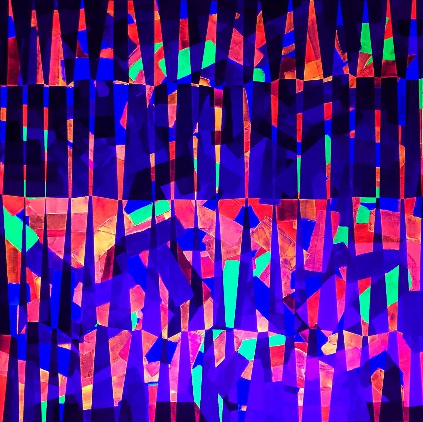 Metallic and fluorescent acrylics painting with colorful stripes and angles, under UV light